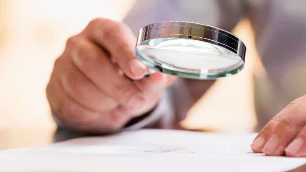 magnifying glass over a document
